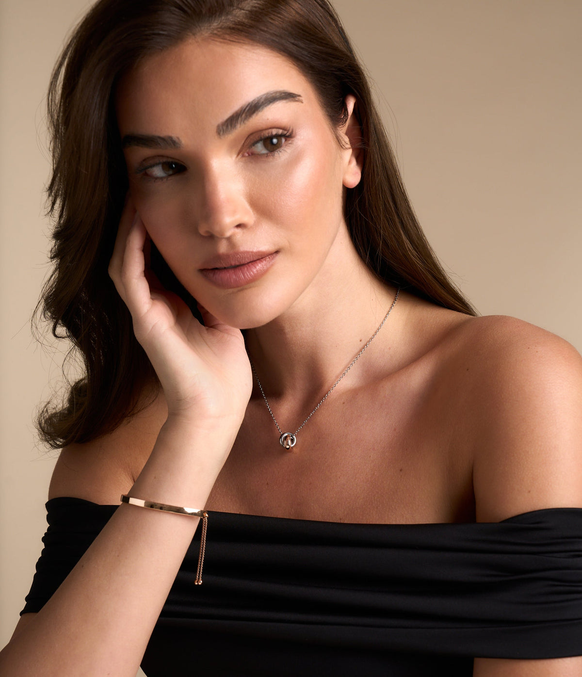 Model wears classic gold tone jewellery by Buckley London
