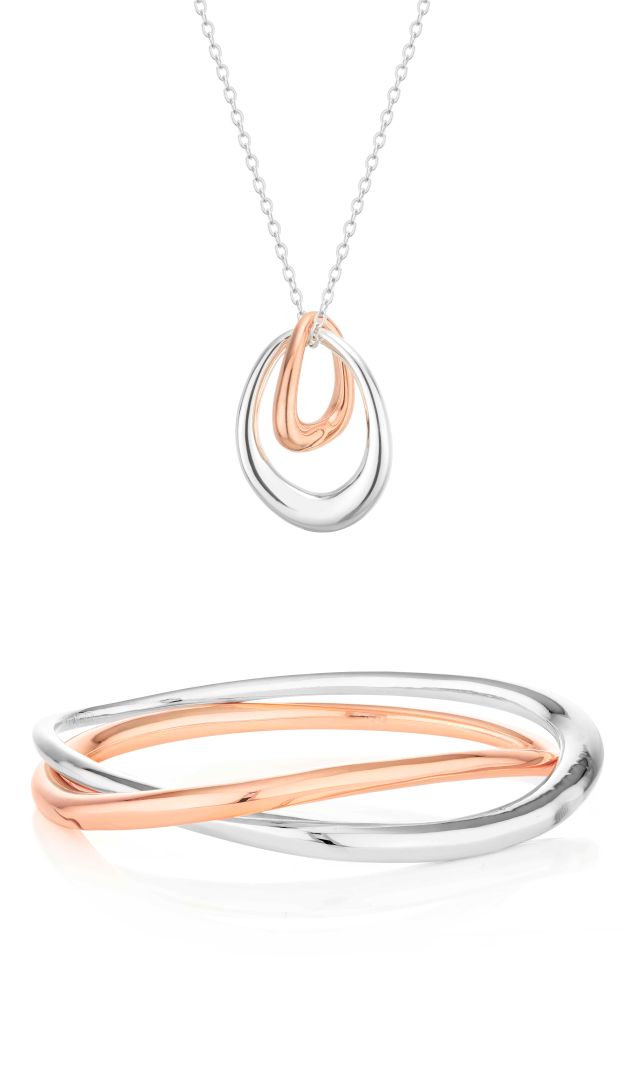 Two-piece jewelry set with a ring and bangle in rose gold and rhodium plate by Buckley London.