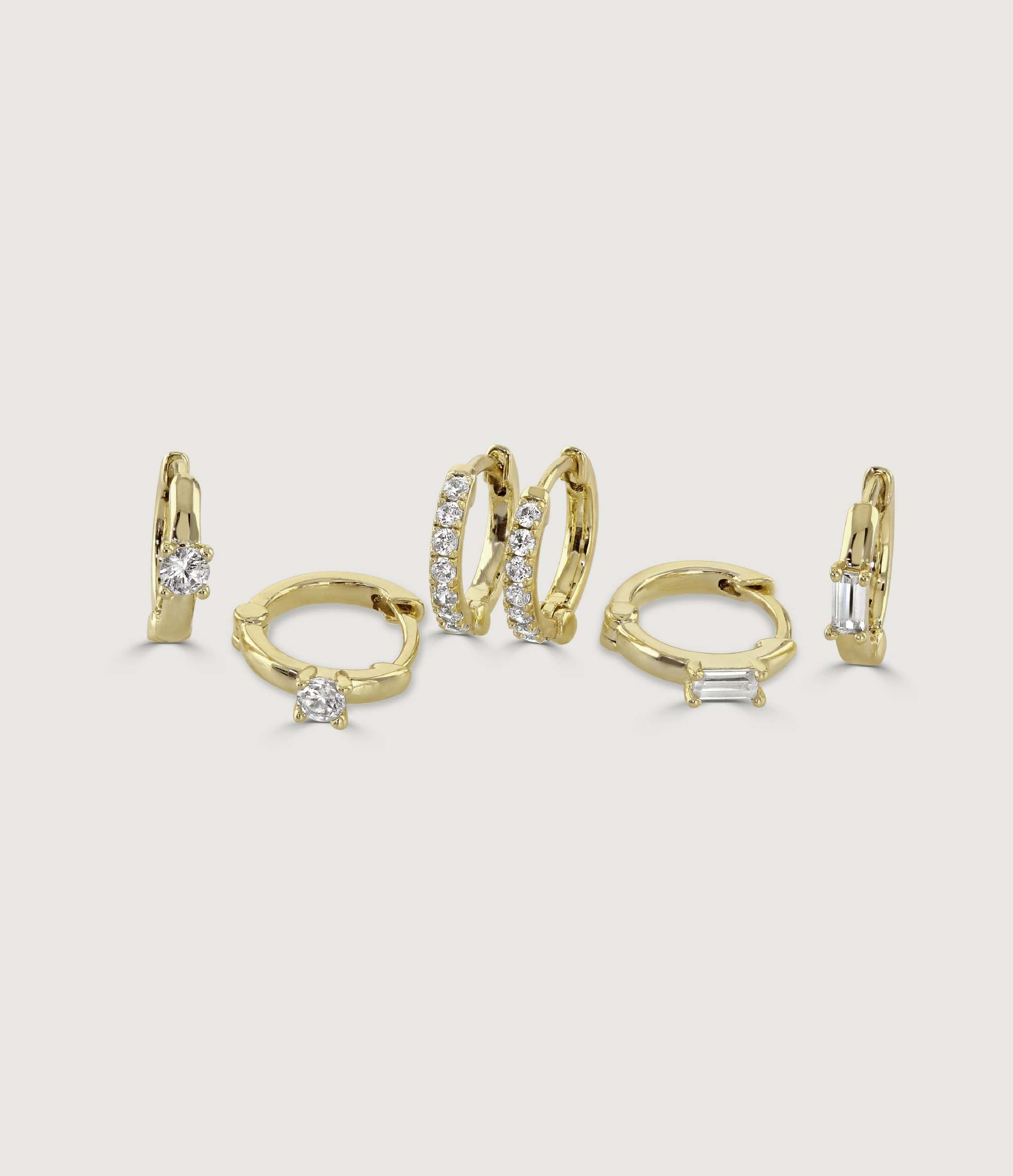 SET OF THREE GOLD AND CRYSTAL HUGGIE EARRING SET